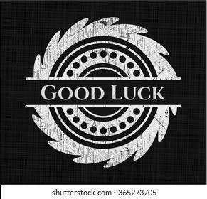 Good Luck chalkboard emblem written on a blackboard