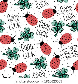 Good luck charms talisman seamless vector pattern. Ladybug, four-leaf clover, Good Luck lettering repeating hand drawn fortune background. Use for New Years, fabric, packaging. Vector illustration.