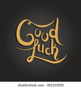 Good luck hand lettering. Hand made vector calligraphy on dark background. Typography design element.