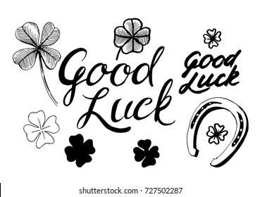 Good luck. Set of hand drawn lettering with horseshoe nd four-leaf clover. Vector
