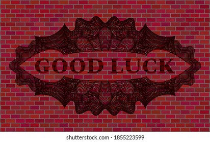 Good luck text inside Guilloche red brick wall emblem. Tiles fancy background. Artistic illustration. 