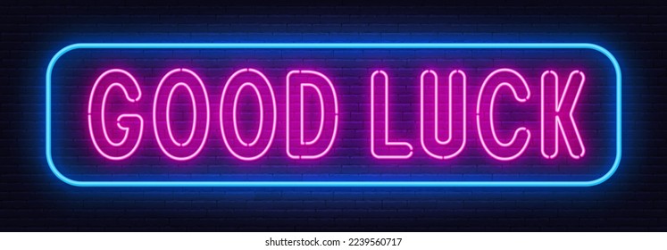 Good Luckneon sign on brick wall background.