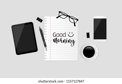 Good morning text on note paper with smartphone, coffee cup, tablet, pen, black paper clips and eyeglasses on gray background. Vector illustration
