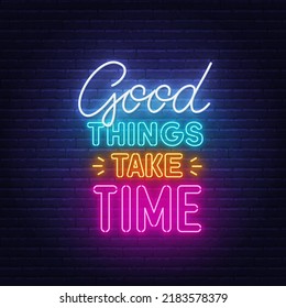 Good things take time neon quote on a brick wall.
