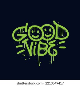 Good vibe - Sprayed urban graffiti font with overspray drops in neon green over black. Smiling emoticons. Vector had written typography illustration.