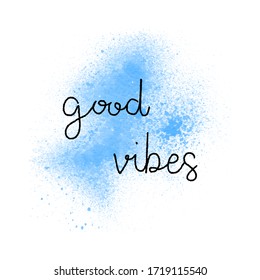 Good vibes hand lettering on blue watercolor background.