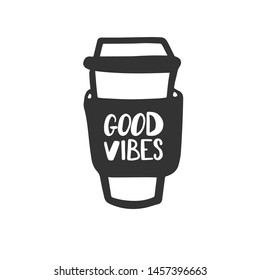 Good vibes. Motivational phrase on a coffee glass. Hand lettering brush and ink.