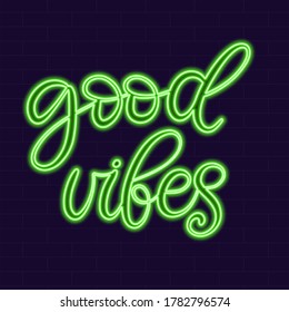 Good vibes neon sign calligraphic lettering vector illustration with calligraphy style word. Handwritten text for fabric print, logo, poster, card. Light banner, glowing neon signboard.