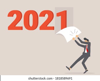 Goodbye 2020. A businessman tears off a wall sheet of the outgoing year. Parting with coming year. Vector illustration flat design.