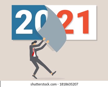 Goodbye 2020. A businessman tears off a calendar sheet of the outgoing year. Parting with coming year.