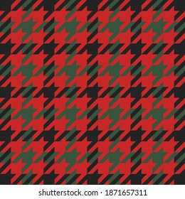Goose foot. Christmas Pattern of crow's feet in red and green cage. Glen plaid. Houndstooth tartan tweed. Dogs tooth. Scottish checkered background. Seamless fabric texture. Vector illustration