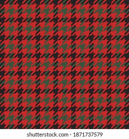 Goose foot. Christmas Pattern of crow's feet in red and green cage. Glen plaid. Houndstooth tartan tweed. Dogs tooth. Scottish checkered background. Seamless fabric texture. Vector illustration