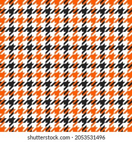 Goose foot. Halloween Pattern of crow's feet in orange, black and white cage. Glen plaid. Houndstooth tartan tweed. Dogs tooth. Scottish cage. Seamless fabric texture. Vector illustration