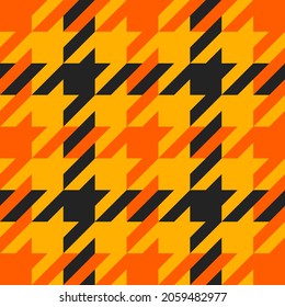 Goose foot. Halloween Pattern of crow's feet in orange, black and yellow cage. Glen plaid. Houndstooth tartan tweed. Dogs tooth. Scottish cage. Seamless fabric texture. Vector illustration