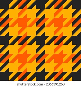 Goose foot. Halloween Pattern of crow's feet in orange, black and yellow cage. Glen plaid. Houndstooth tartan tweed. Dogs tooth. Scottish cage. Seamless fabric texture. Vector illustration