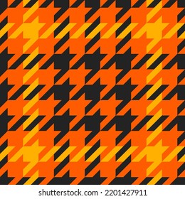 Goose foot. Halloween Pattern of crow's feet in orange, black and yellow cage. Glen plaid. Houndstooth tartan tweed. Dogs tooth. Scottish cage. Seamless fabric texture. Vector illustration