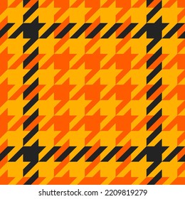 Goose foot. Halloween Pattern of crow's feet in orange, black and yellow cage. Glen plaid. Houndstooth tartan tweed. Dogs tooth. Scottish cage. Seamless fabric texture. Vector illustration