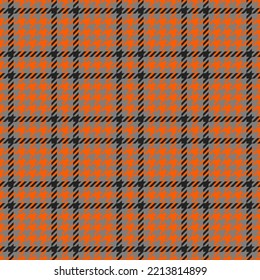 Goose foot. Halloween Pattern of crow's feet in orange, black and gray cage. Glen plaid. Houndstooth tartan tweed. Dogs tooth. Scottish cage. Seamless fabric texture. Vector illustration