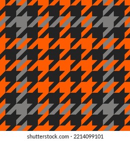 Goose foot. Halloween Pattern of crow's feet in orange, black and gray cage. Glen plaid. Houndstooth tartan tweed. Dogs tooth. Scottish cage. Seamless fabric texture. Vector illustration