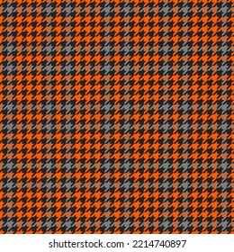 Goose foot. Halloween Pattern of crow's feet in orange, black and gray cage. Glen plaid. Houndstooth tartan tweed. Dogs tooth. Scottish cage. Seamless fabric texture. Vector illustration