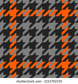 Goose foot. Halloween Pattern of crow's feet in orange, black and gray cage. Glen plaid. Houndstooth tartan tweed. Dogs tooth. Scottish cage. Seamless fabric texture. Vector illustration