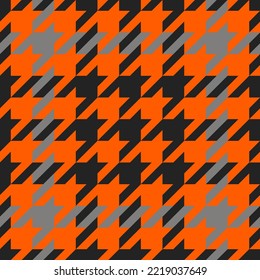 Goose foot. Halloween Pattern of crow's feet in orange, black and gray cage. Glen plaid. Houndstooth tartan tweed. Dogs tooth. Scottish cage. Seamless fabric texture. Vector illustration
