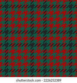 Goose foot. Pattern of crow's feet in black, red, green cage. Glen plaid. Houndstooth tartan tweed. Dogs tooth. Scottish checkered background. Seamless fabric texture. Vector illustration