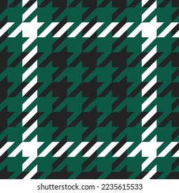 Goose foot. Pattern of crow's feet in black, green, white cage. Glen plaid. Houndstooth tartan tweed. Dogs tooth. Scottish checkered background. Seamless fabric texture. Vector illustration