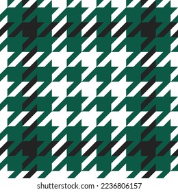 Goose foot. Pattern of crow's feet in black, green, white cage. Glen plaid. Houndstooth tartan tweed. Dogs tooth. Scottish checkered background. Seamless fabric texture. Vector illustration