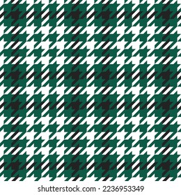 Goose foot. Pattern of crow's feet in black, green, white cage. Glen plaid. Houndstooth tartan tweed. Dogs tooth. Scottish checkered background. Seamless fabric texture. Vector illustration