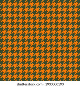 Goose foot. St. Patricks day pattern of crow's feet in green and orange. Glen plaid. Houndstooth tartan tweed. Dogs tooth. Scottish checkered background. Seamless fabric texture. Vector illustration