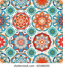 Gorgeous floral tile design. Moroccan or Mediterranean octagon tiles, tribal ornaments. For wallpaper print, pattern fills, web page background, surface textures. Orange blue tone