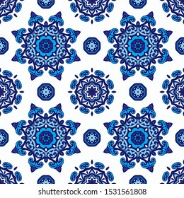 Gorgeous seamless pattern from blue and white mandalas stars and snowflakes ornaments. Can be used for wallpaper, backgrounds, decoration for your design, ceramic, page fill and more.