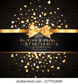 Gorgeous and shiny invitation card or banner with gold ribbon bow and sparkling golden hart-shaped glitter on black background with delicate pattern