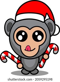 gorilla animal mascot costume cartoon character vector wearing cute christmas hat holding christmas candy
