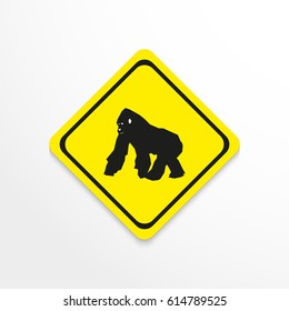 Gorilla. Black and white image in yellow sign on a light background. Vector icon.