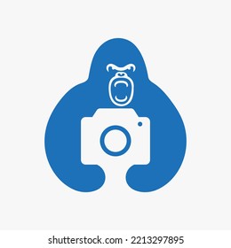 Gorilla Camera Logo Negative Space Concept Vector Template. Gorilla Holding Camera Symbol