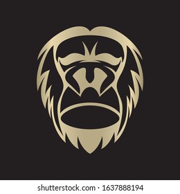 Gorilla head gold vector logo element. On black background.