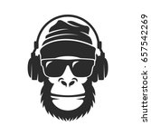 Gorilla in a knitted hat, sunglasses and headphones. Cool Monkey