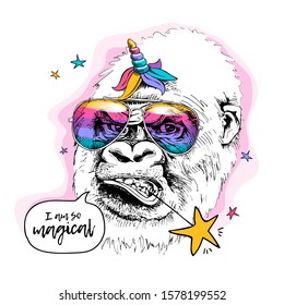 Gorilla in a rainbow glasses, unicorn mane and horn. I am so magical - lettering quote. Humor card, t-shirt composition, hand drawn style print. Vector illustration.