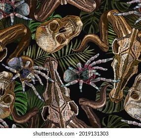 Gothic embroidery. Human skulls, pal leaves, tarantula spider and bull head, clothes background. Tropical seamless pattern. Halloween dark background. Fashionable template for clothes 