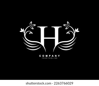 Graceful monogram design element. pretty wings logogram. White letter H emblem typography with flourish wings for Royalty, business card, Boutique, Hotel, Restaurant, Jewellery, business, company