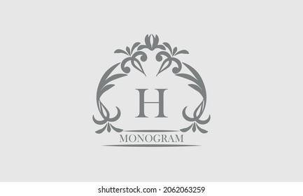 Graceful monogram in gray tones with the inscription and the letter H. Exquisite sign, logo of a restaurant, boutique, hotel, business