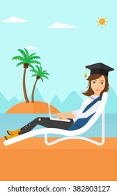 Graduate lying on chaise lounge with laptop.