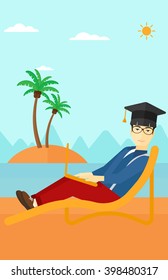 Graduate lying on chaise lounge with laptop.