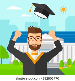 Graduate throwing up his hat.