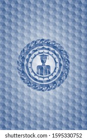 graduated icon inside blue emblem with geometric pattern.