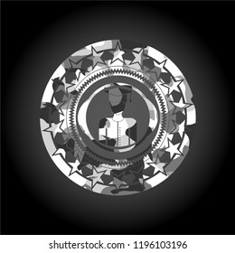 graduated icon inside grey camo emblem
