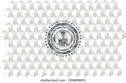 graduated icon inside grey emblem with geometric cube white background