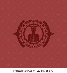 graduated icon inside red emblem. 